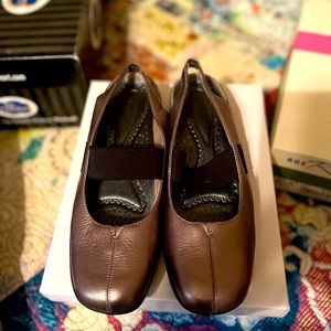 Low heel slip on with sling back.  Comfort and style